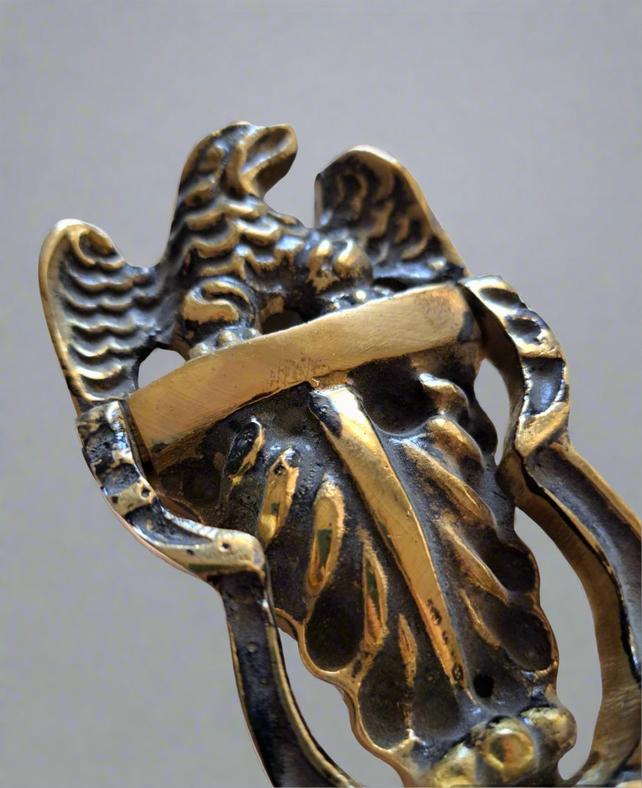 Solid metal door knocker with patriotic eagle motif in gold