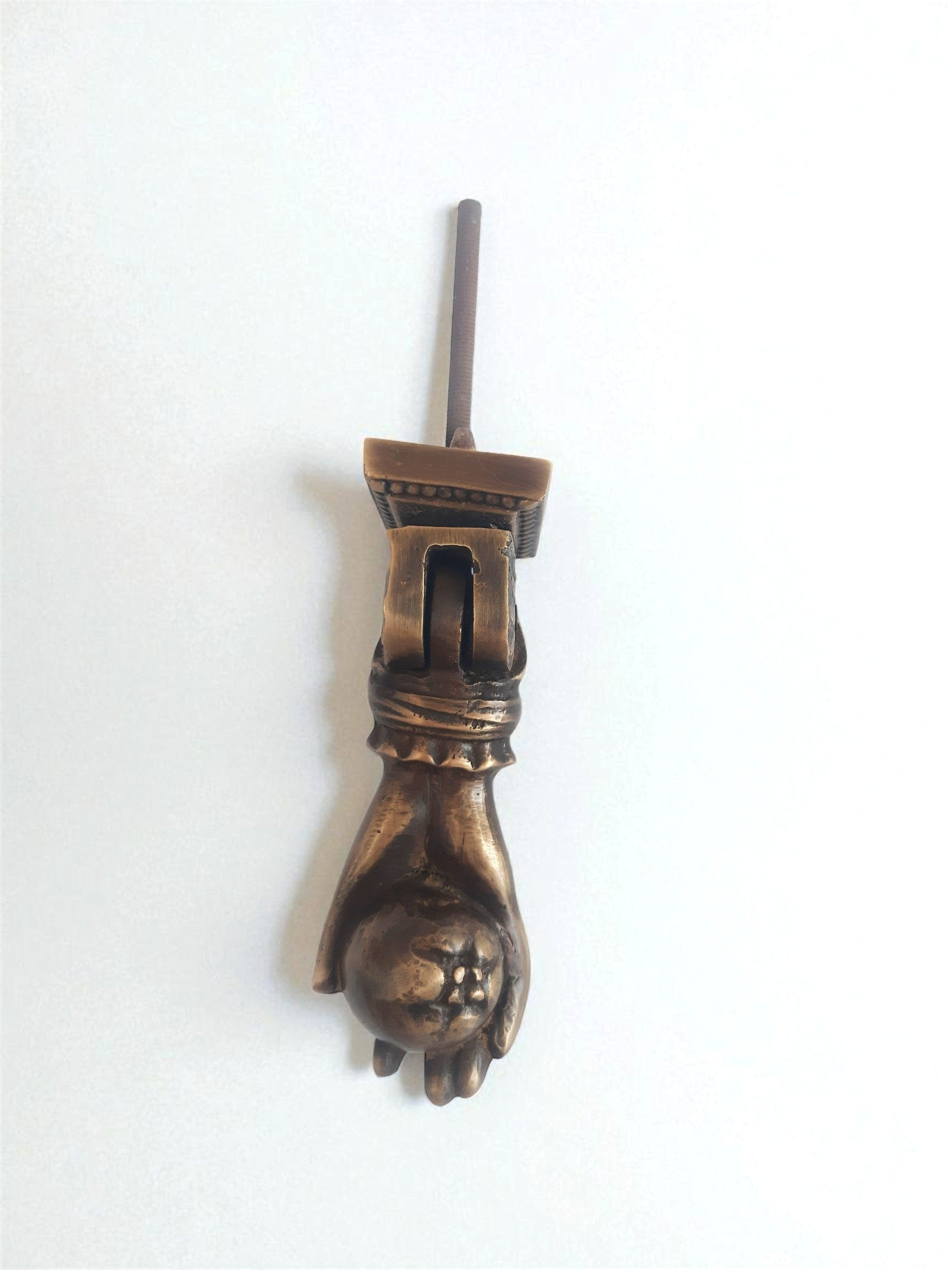 Bronze decorative object on a white background