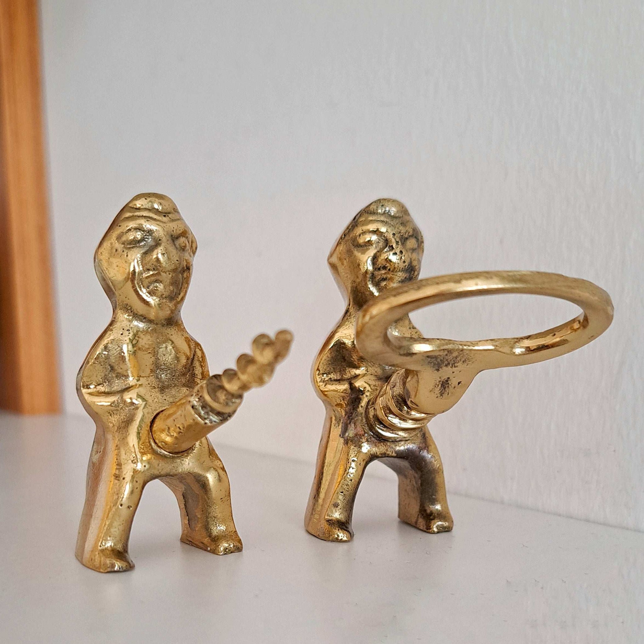 Funny vintage-style Priapus opener set on white background