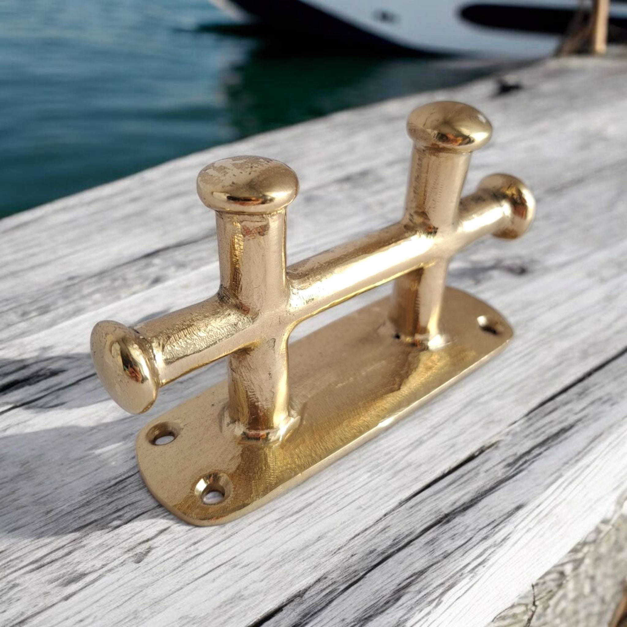 Compact nautical cleat in polished solid brass