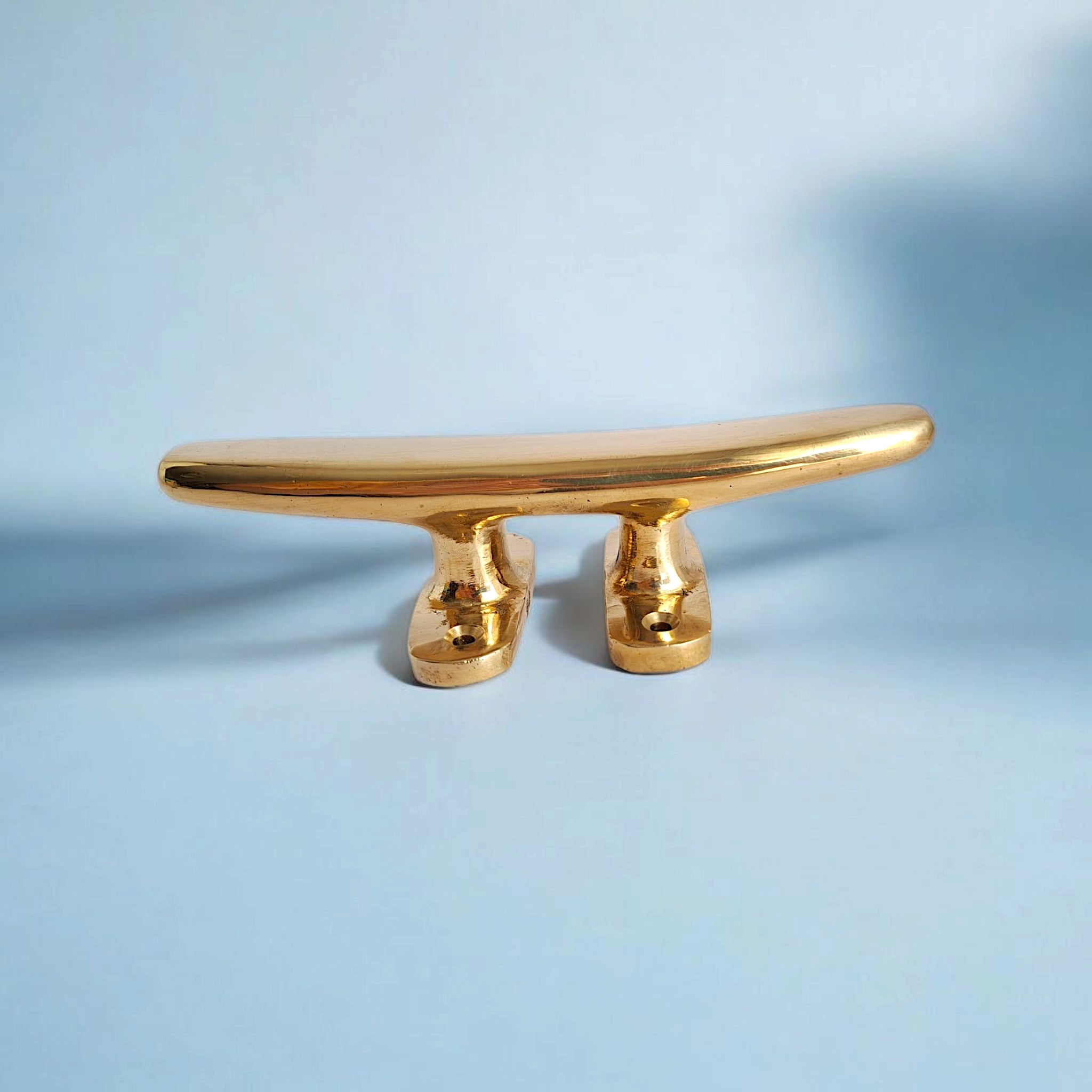 Marine-style brass rope tie cleat in vintage finish