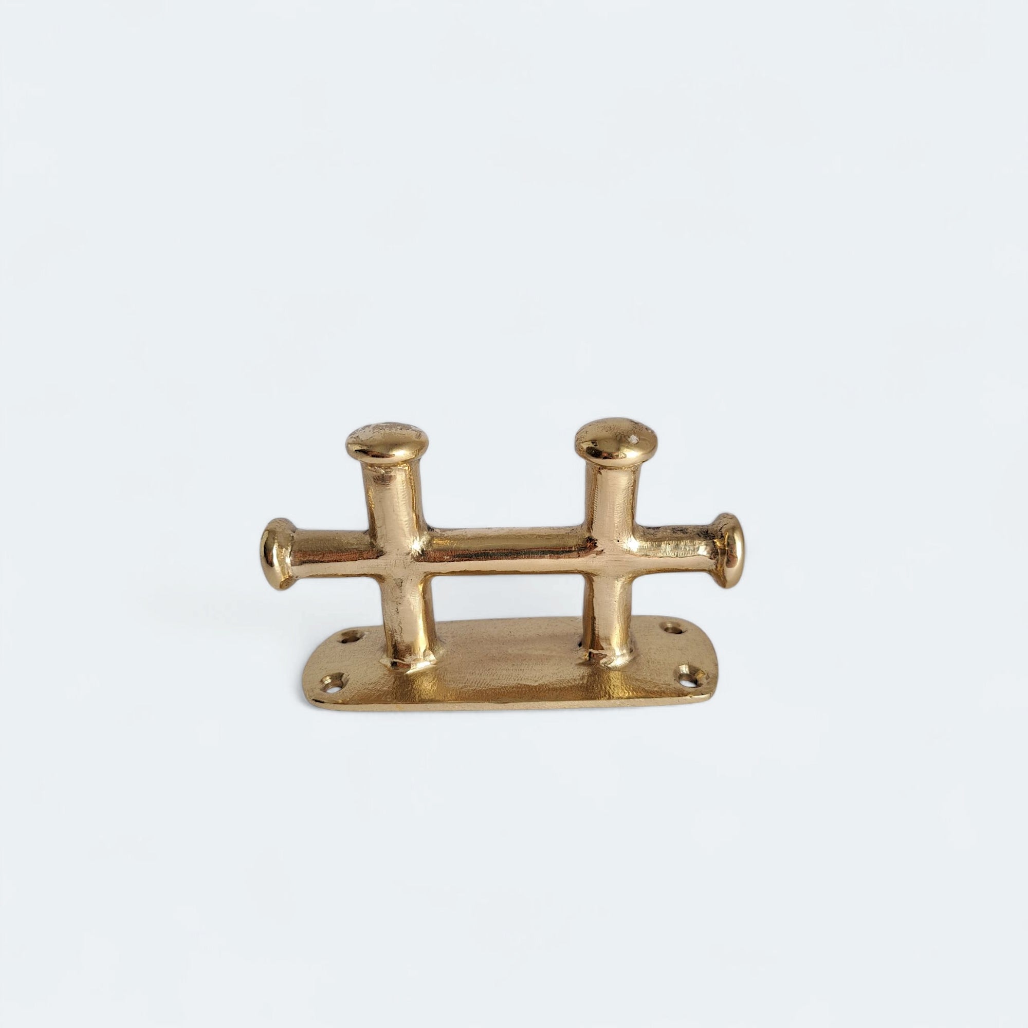Decorative brass rope holder for beach house use