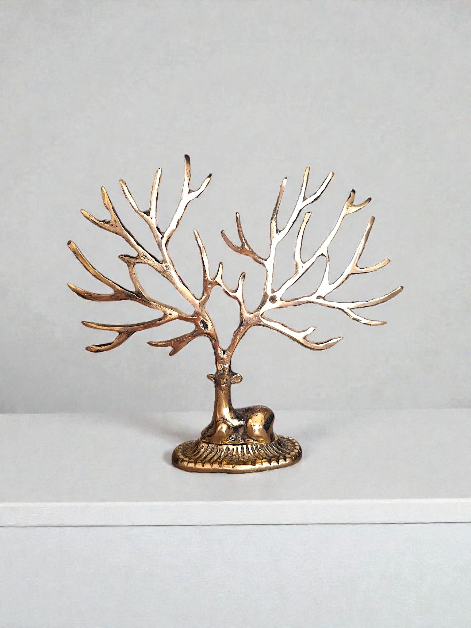 gold brass deer ornament display