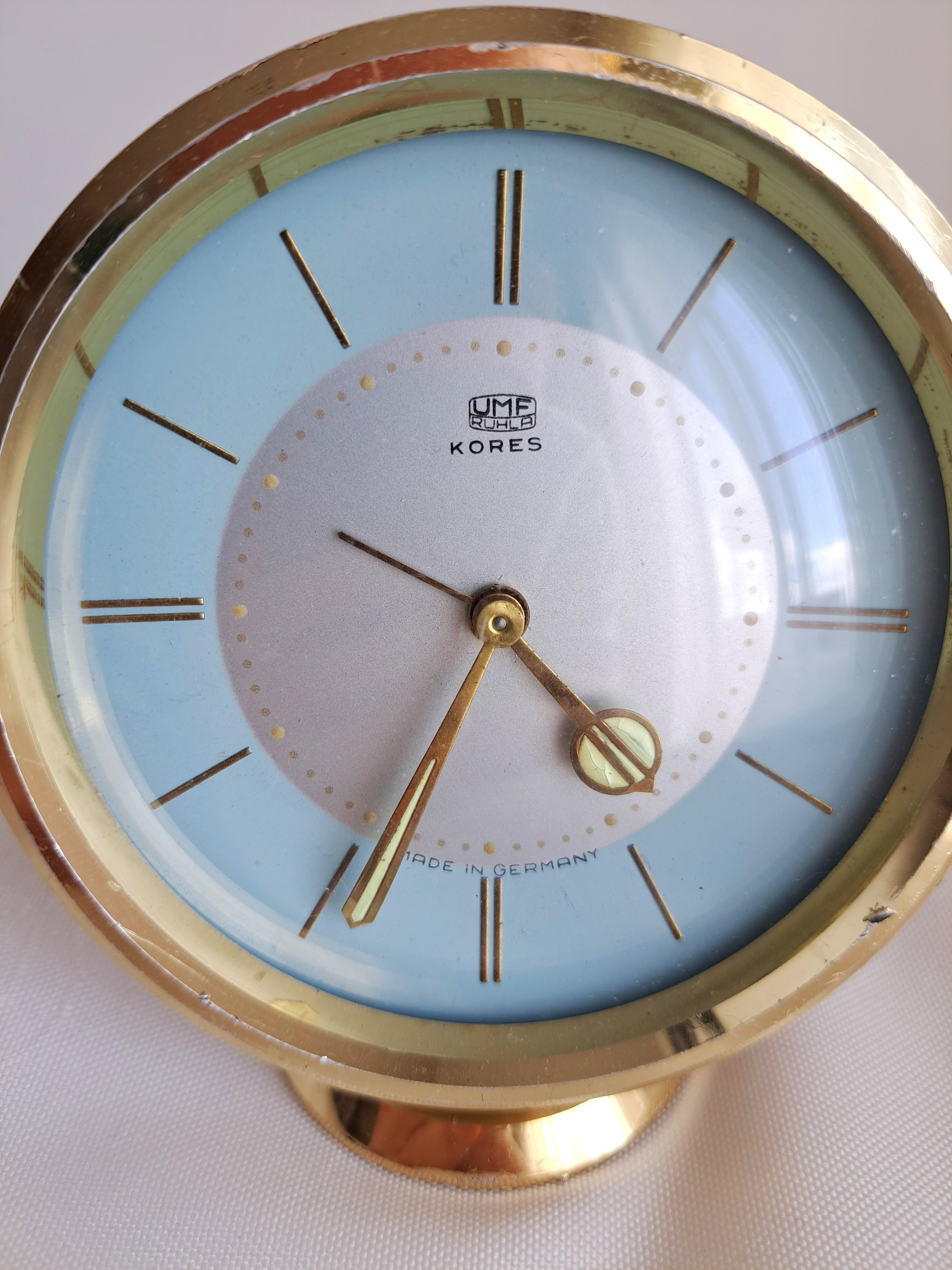 retro blue dial analog table clock close up
