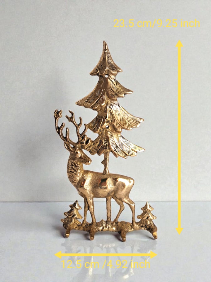 Bronze deer and tree sculpture with measurements on a gray background