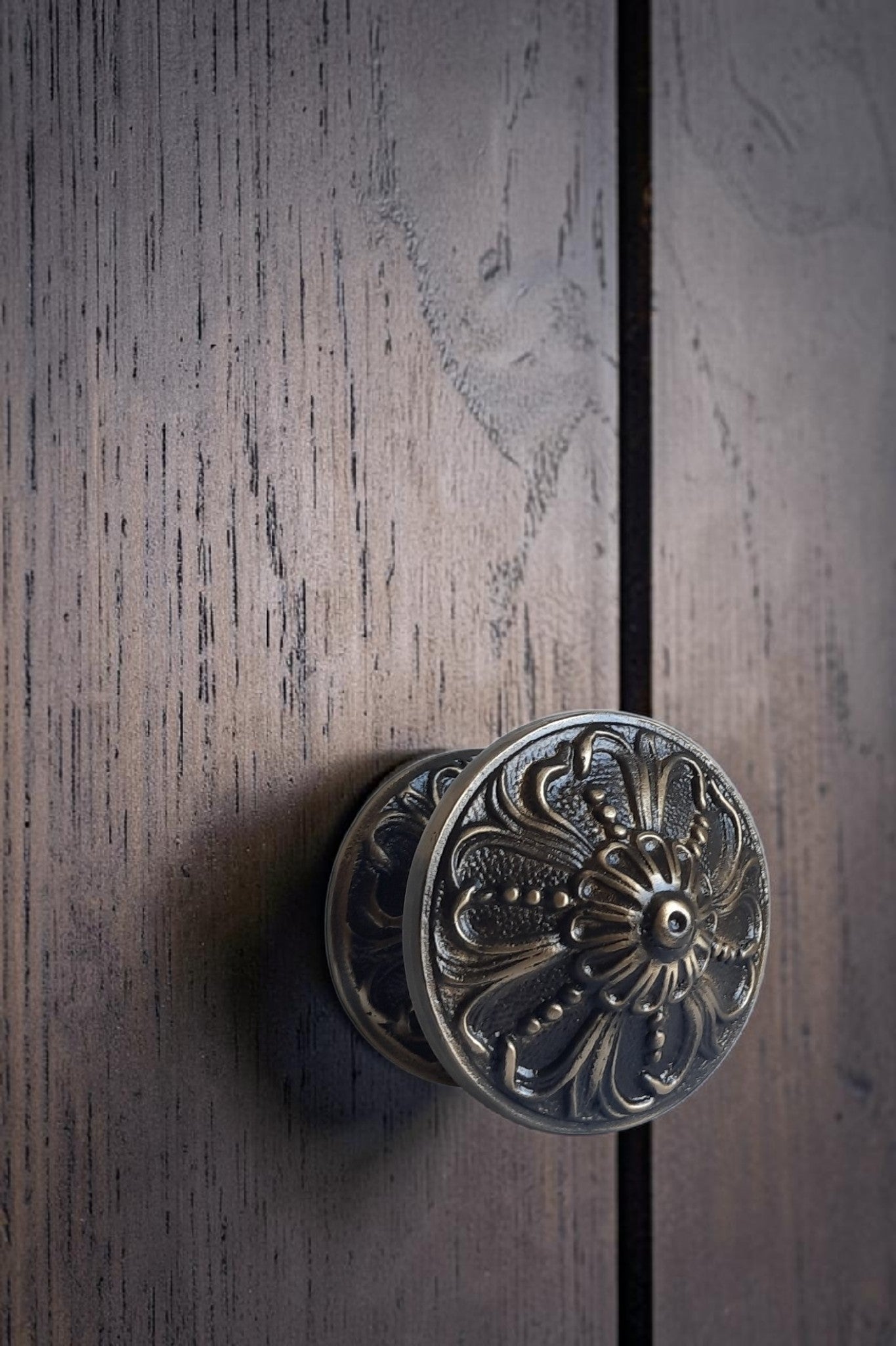 Decorative door handle on a wooden door