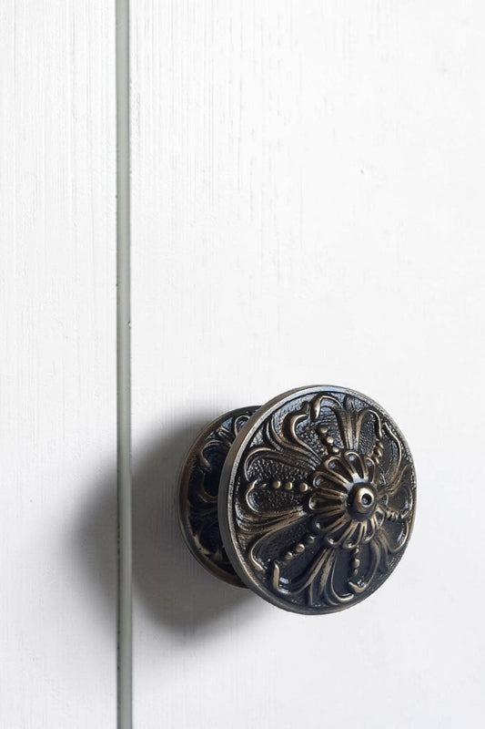 Decorative door handle on a white door