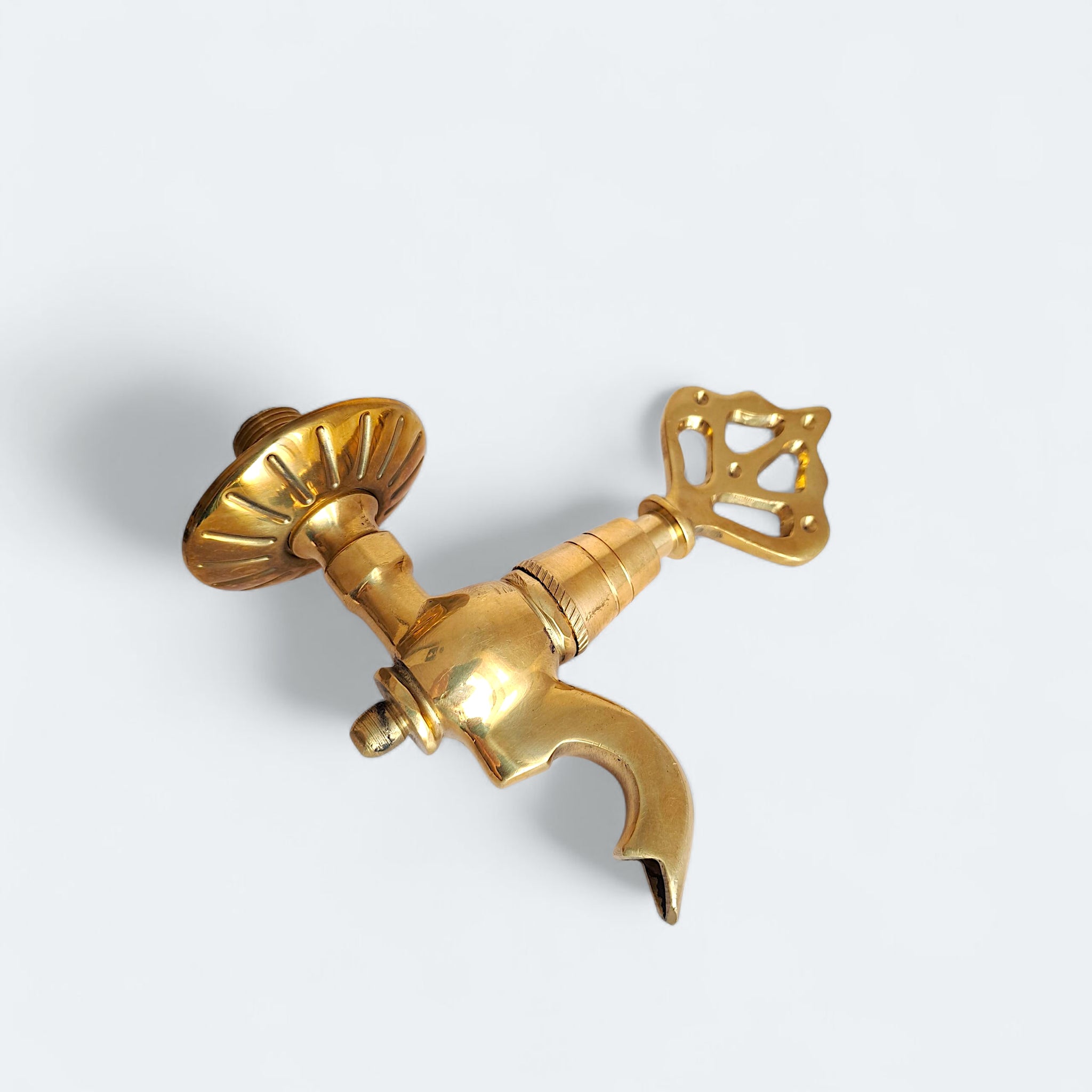 Gold valve handle on a white background