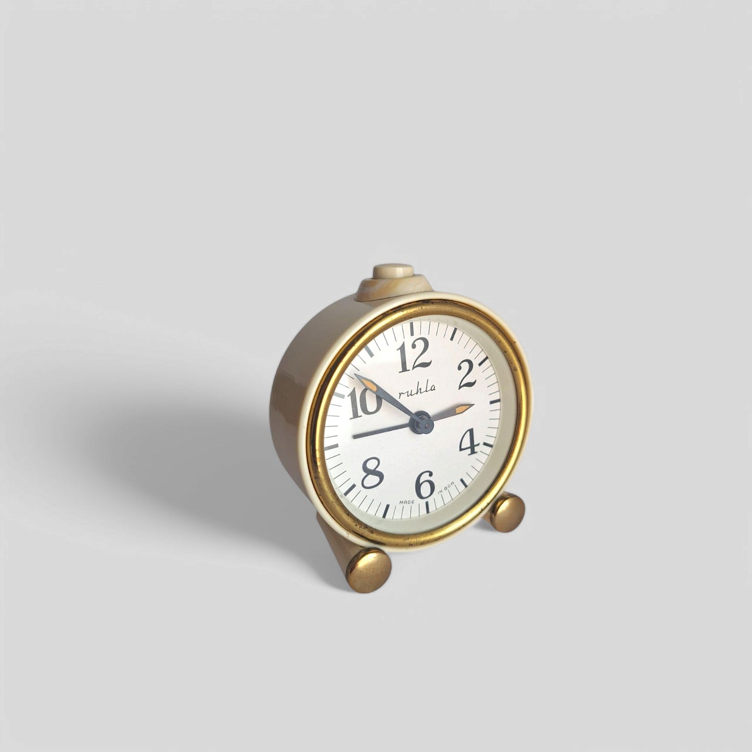Front view of vintage beige mechanical Ruhla clock