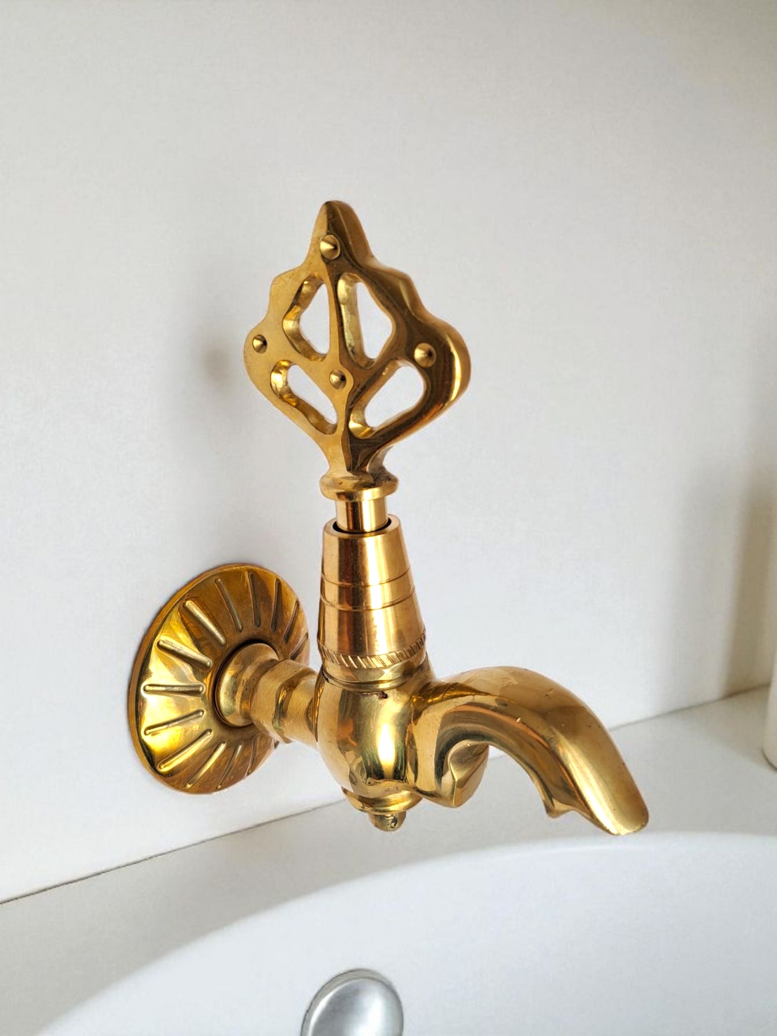Solid brass wall-mounted Ottoman style faucet with ornate gold Ibrik spout.
