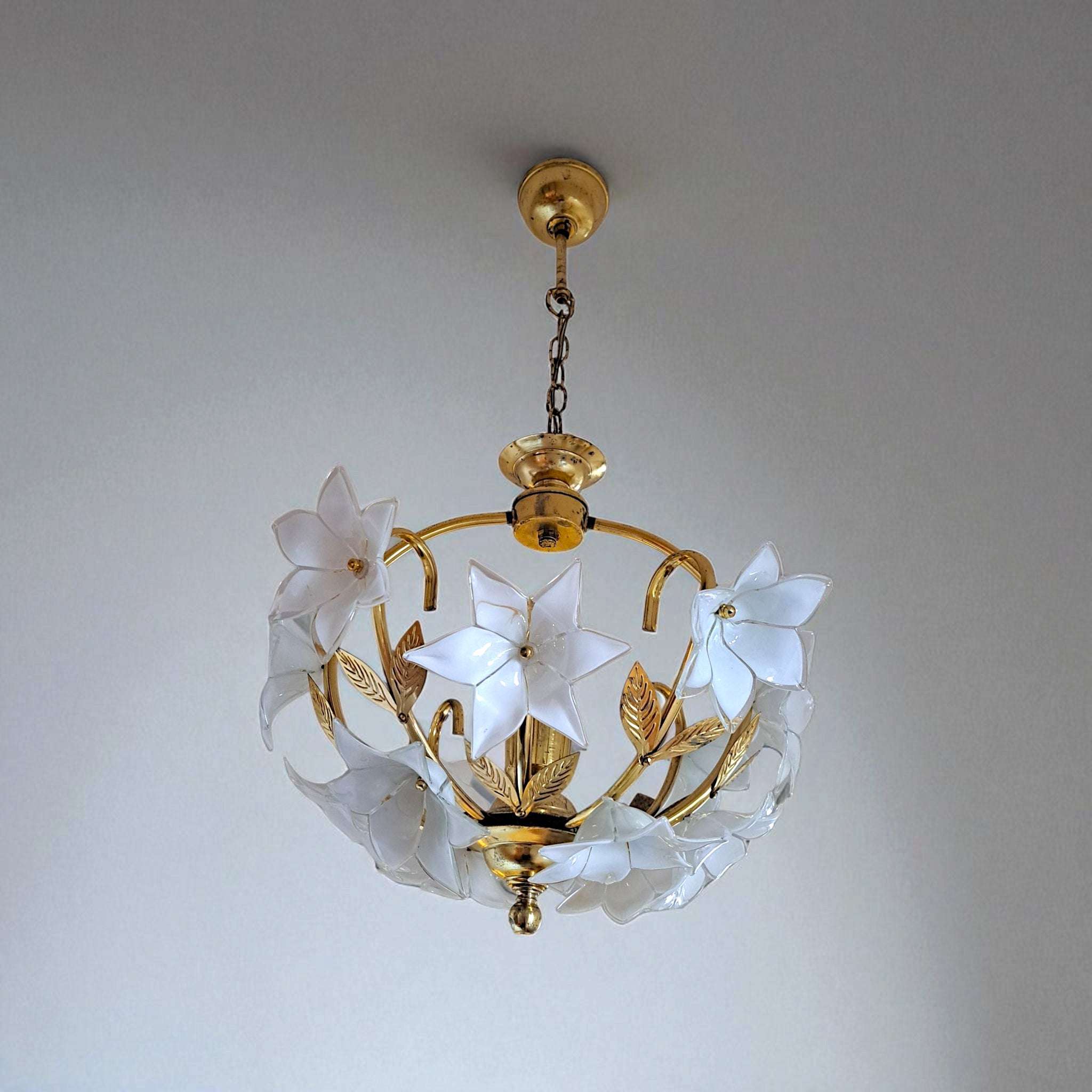 Vintage Murano glass floral chandelier with brass arms illuminated